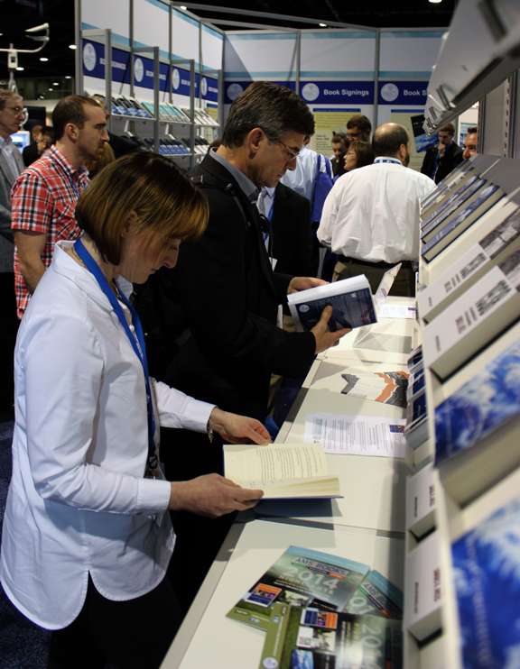 Conference attendees peruse AMS books