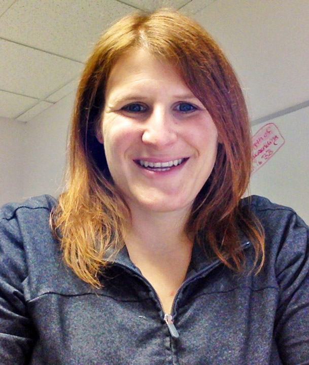 Picture of a woman in an office smiling