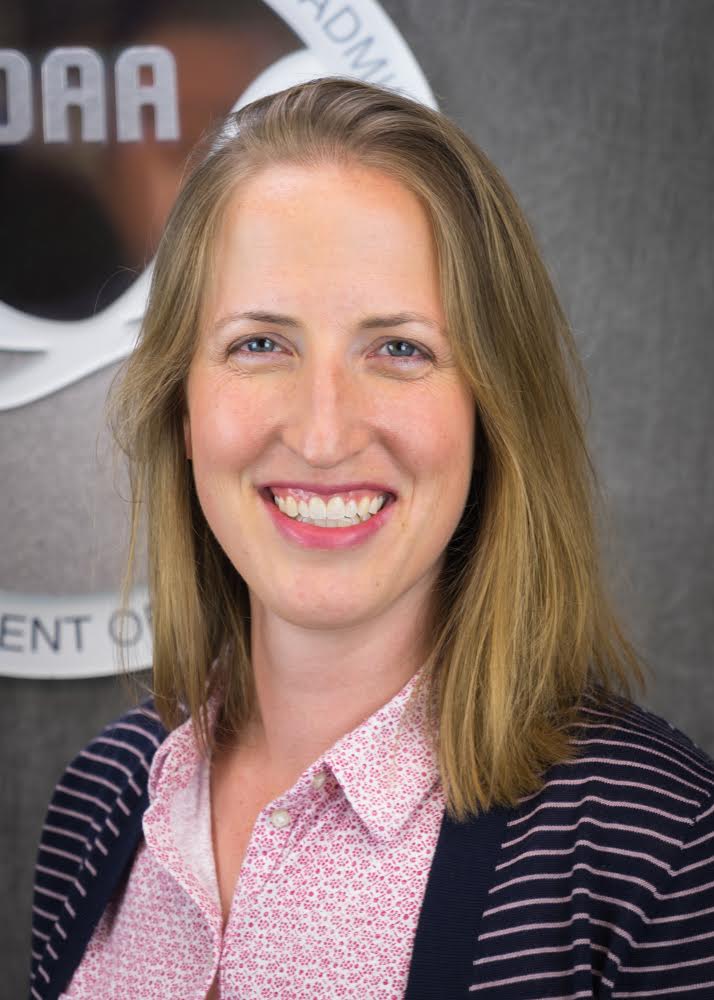 Picture of a woman with light brown hair smiling