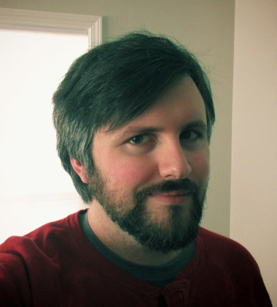 Picture of a man with beard smiling